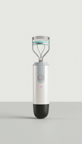 Compact heated eyelash curler with precision tip